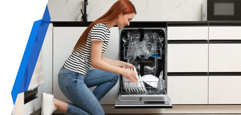 Happy woman taking clean plate from dishwasher - Dishwasher Insurance