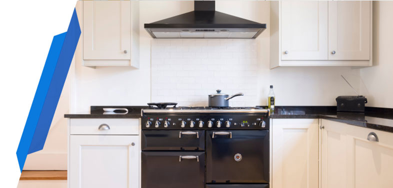 Ceramic hob with overhead extractor hood in a contemporary kitchen