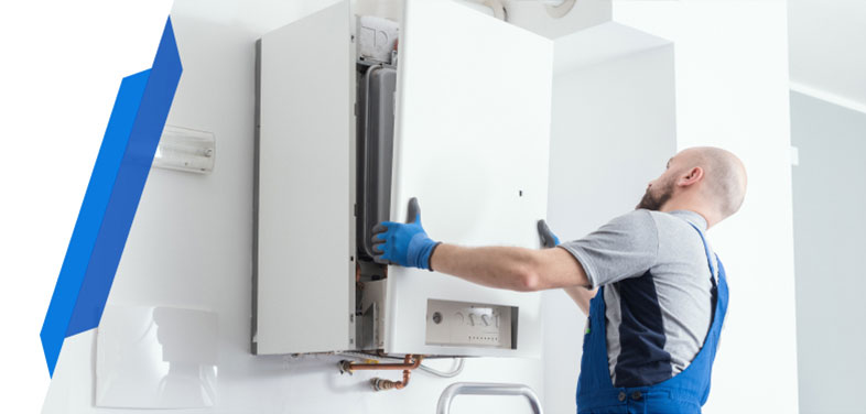 Smart Cover engineer servicing a residential gas boiler in a utility room