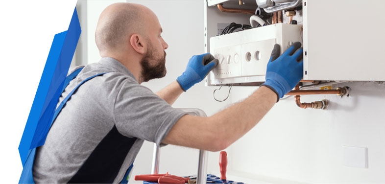 Smart Cover technician performing routine maintenance on a home boiler system