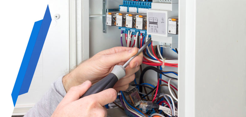 Electrician fixing a faulty fuse box in a residential property