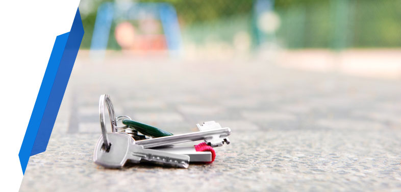 Lost house keys cover by Smart Cover - multiple house keys on a keychain lying on the floor, representing lost or misplaced keys