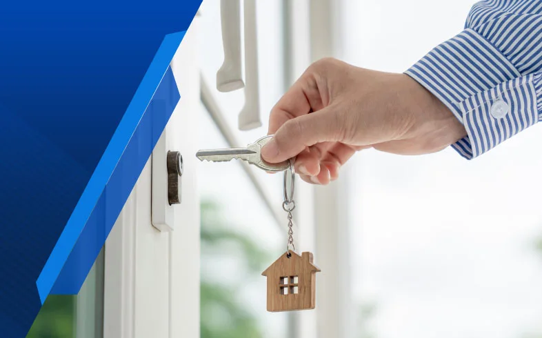 Landlord unlocking door with key, highlighting Smart Cover's emergency insurance coverage