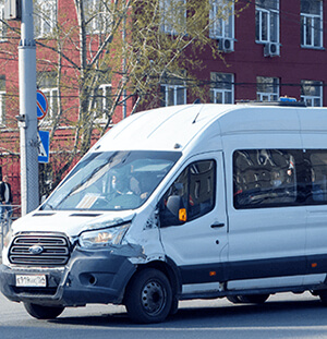 Image of a white taxi minibus
