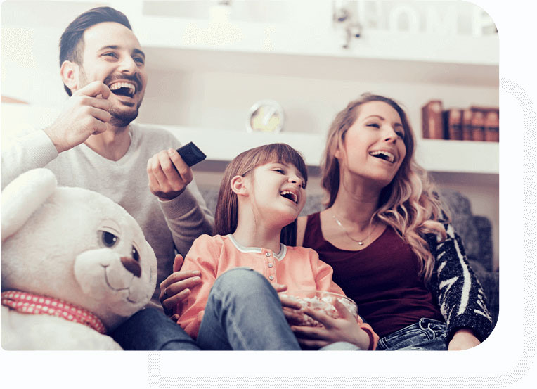 Happy family watching TV under Sky Insurance protection from Smart Cover